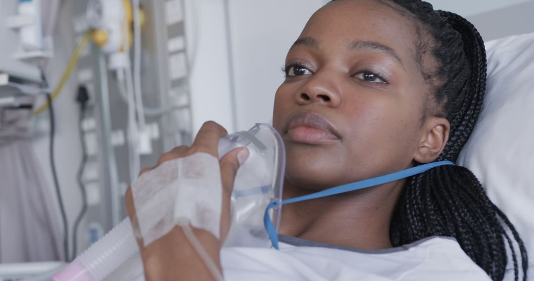 Woman in Hospital Bed Breathing through Oxygen Mask - Free Images, Stock Photos and Pictures on Pikwizard.com