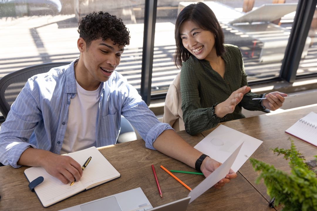 Coworkers Collaborating at Modern Workspace