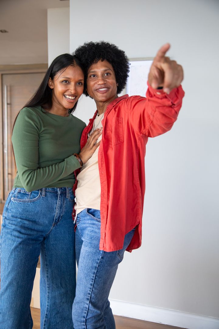 Happy Couple Exploring New Home in Casual Style