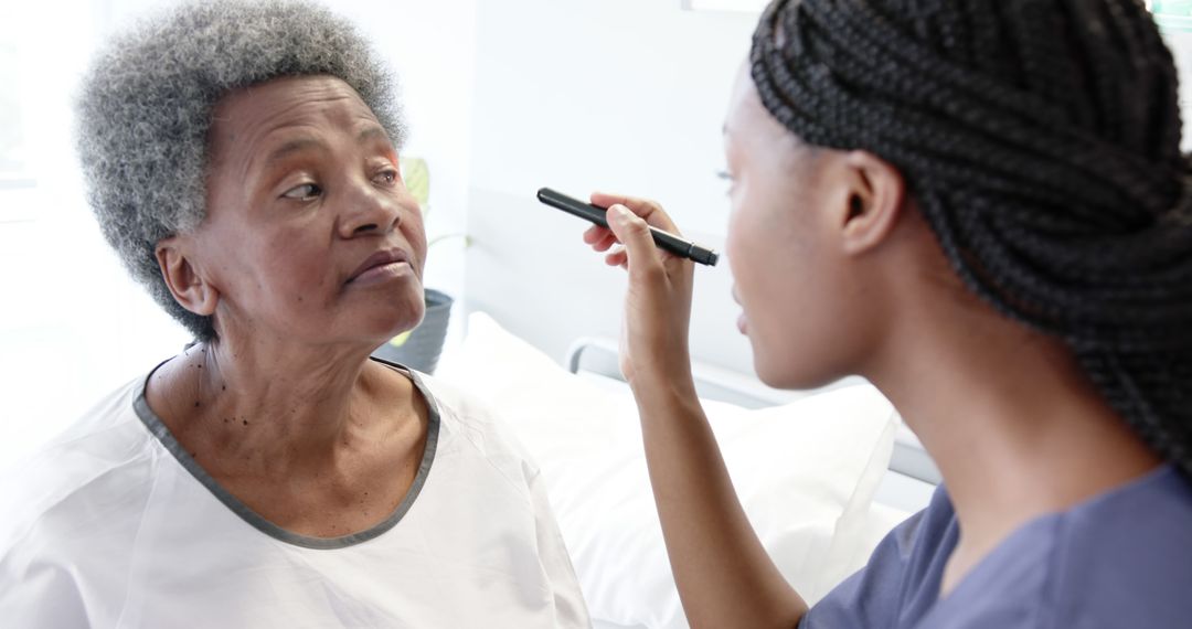 Nurse Caring for Elderly Patient During Eye Examination - Free Images, Stock Photos and Pictures on Pikwizard.com