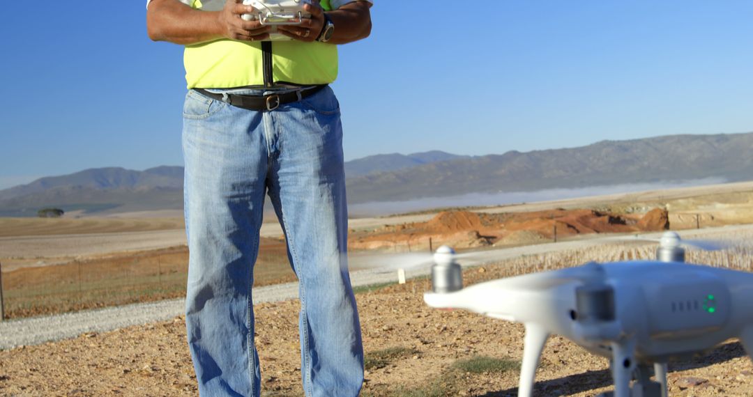 Man Operating Drone in Desert Landscape - Free Images, Stock Photos and Pictures on Pikwizard.com