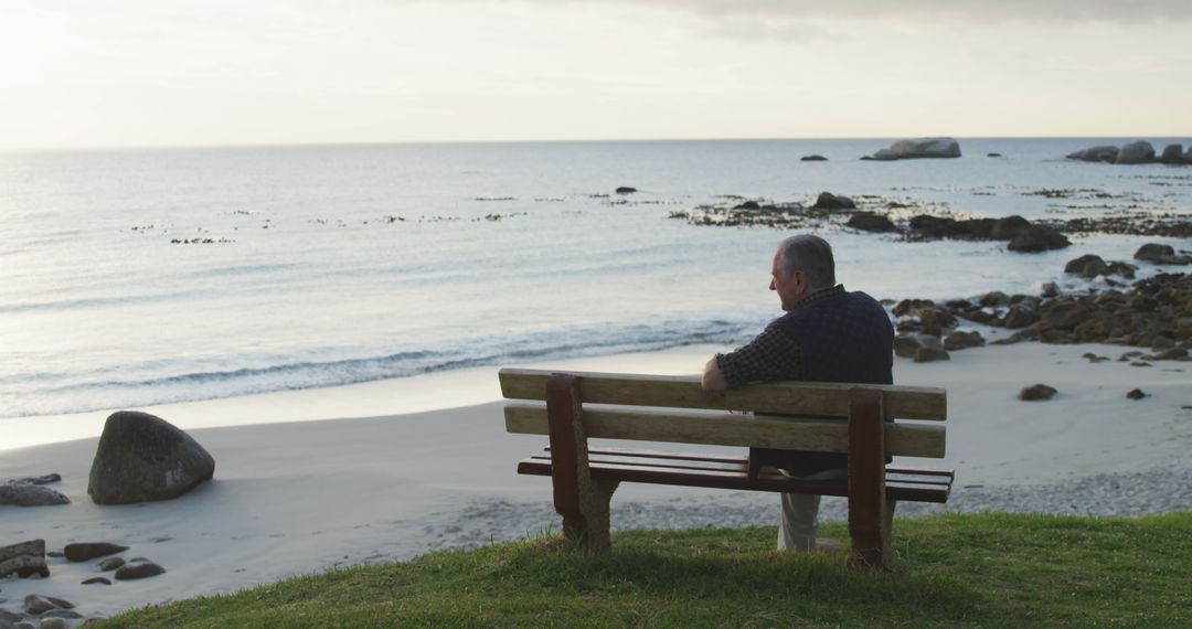 Solitary Senior Man Reflecting on Seaside Bench at Sunset - Free Images, Stock Photos and Pictures on Pikwizard.com