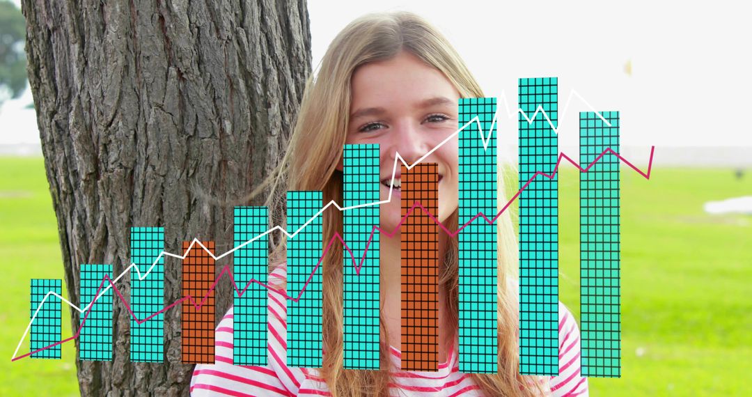 Smiling woman standing in park presenting colorful data overlay with bar and line charts