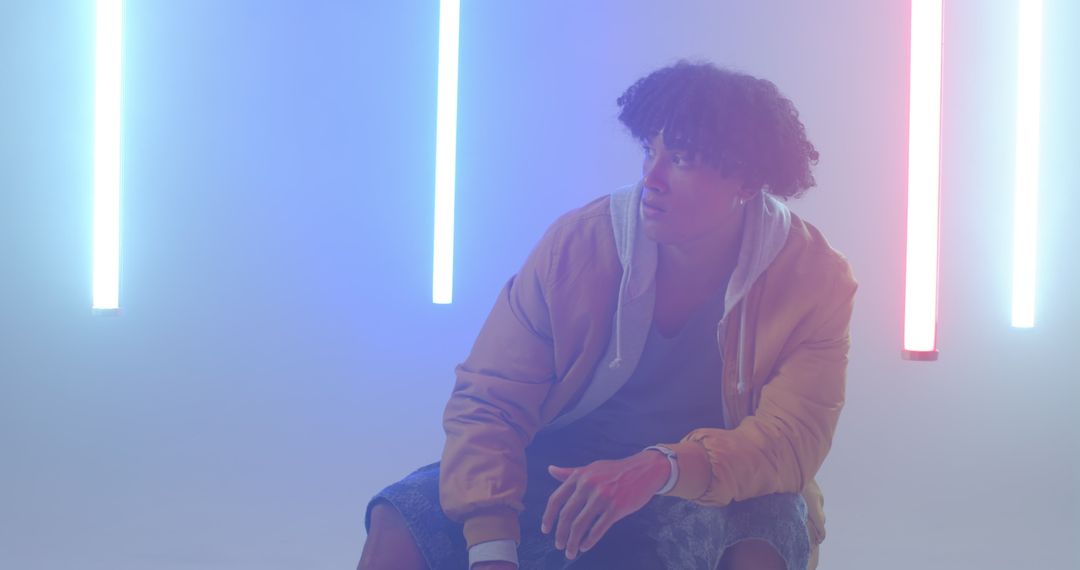 African American Man in Hazy Neon Lit Studio Space