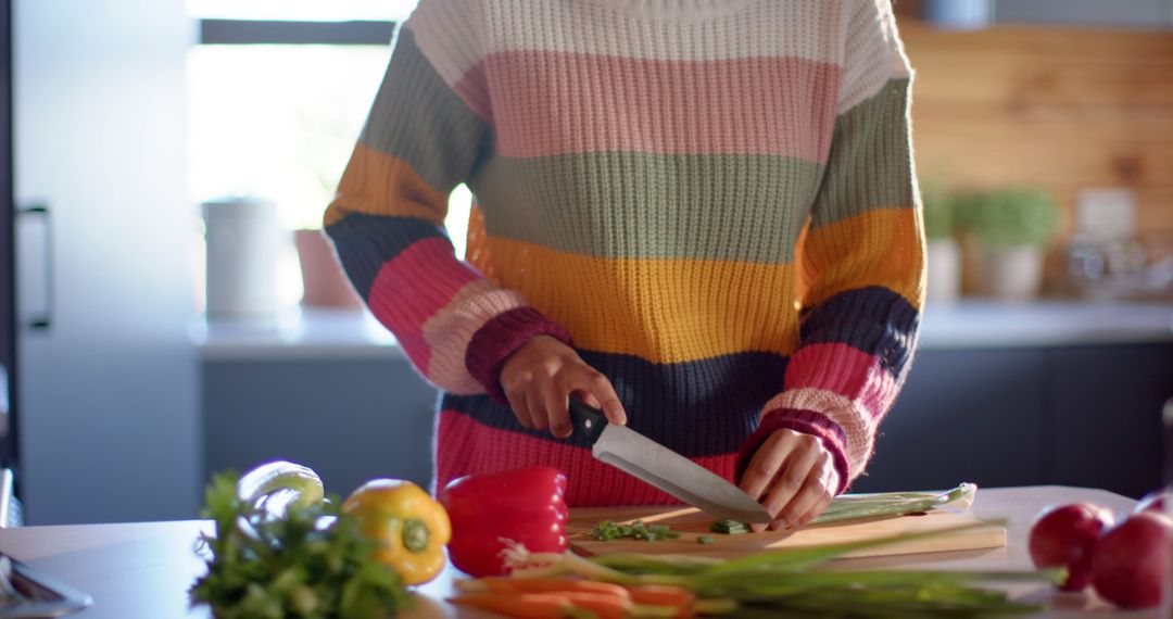 Person Slicing Vegetables in Brightly Lit Kitchen - Free Images, Stock Photos and Pictures on Pikwizard.com