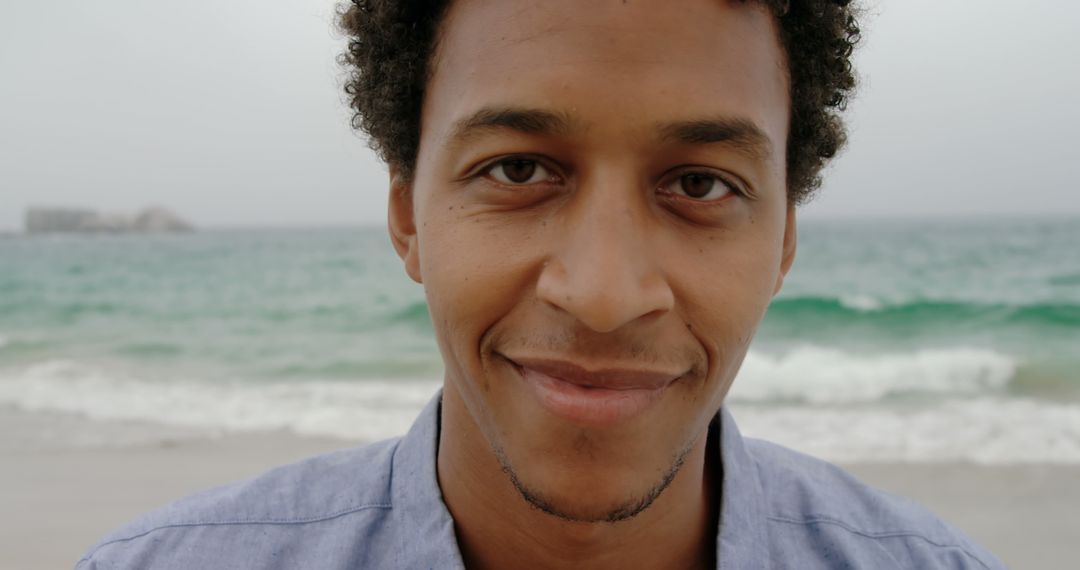 Smiling Man Enjoying Peaceful Beach Ambiance