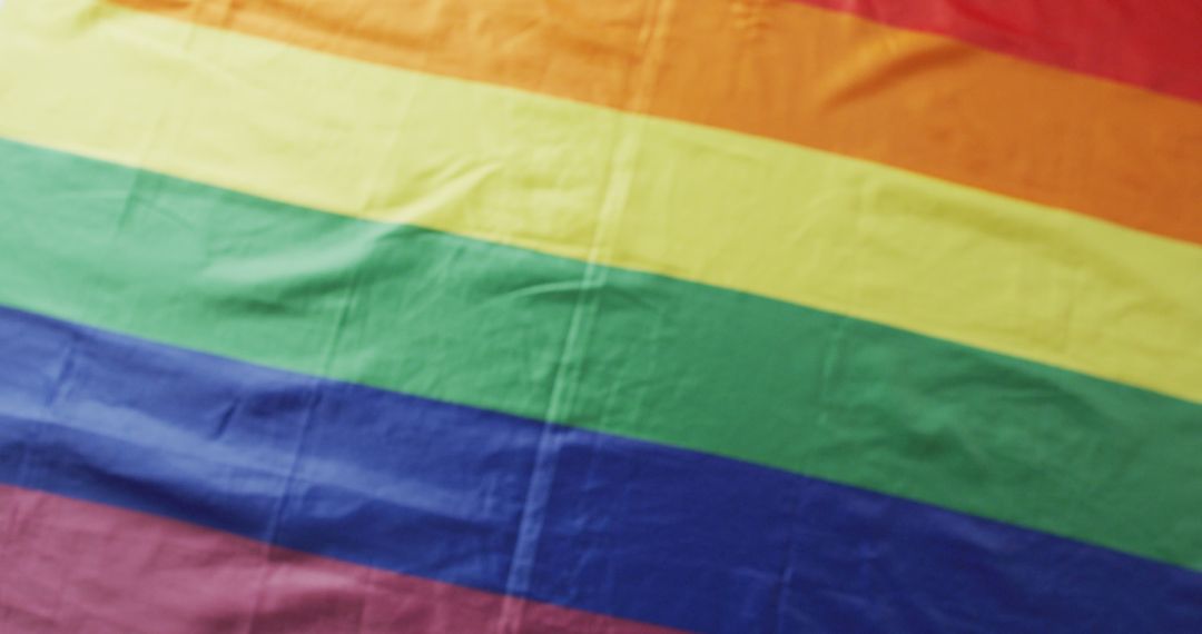 Image of rainbow flag lying on white background - Free Images, Stock Photos and Pictures on Pikwizard.com