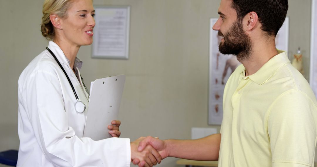 Doctor Greeting Patient with a Handshake in Clinic - Free Images, Stock Photos and Pictures on Pikwizard.com