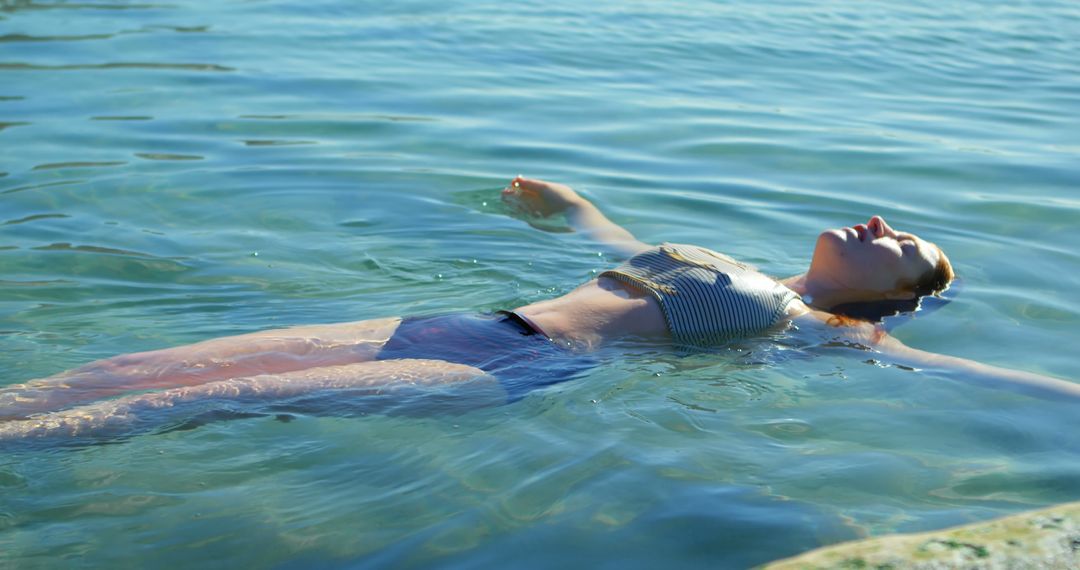 Woman Relaxing Floating on Water in Summer - Free Images, Stock Photos and Pictures on Pikwizard.com