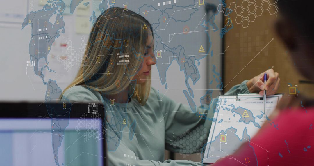 Data Analyst Planning World Map Strategy with Digital Overlays