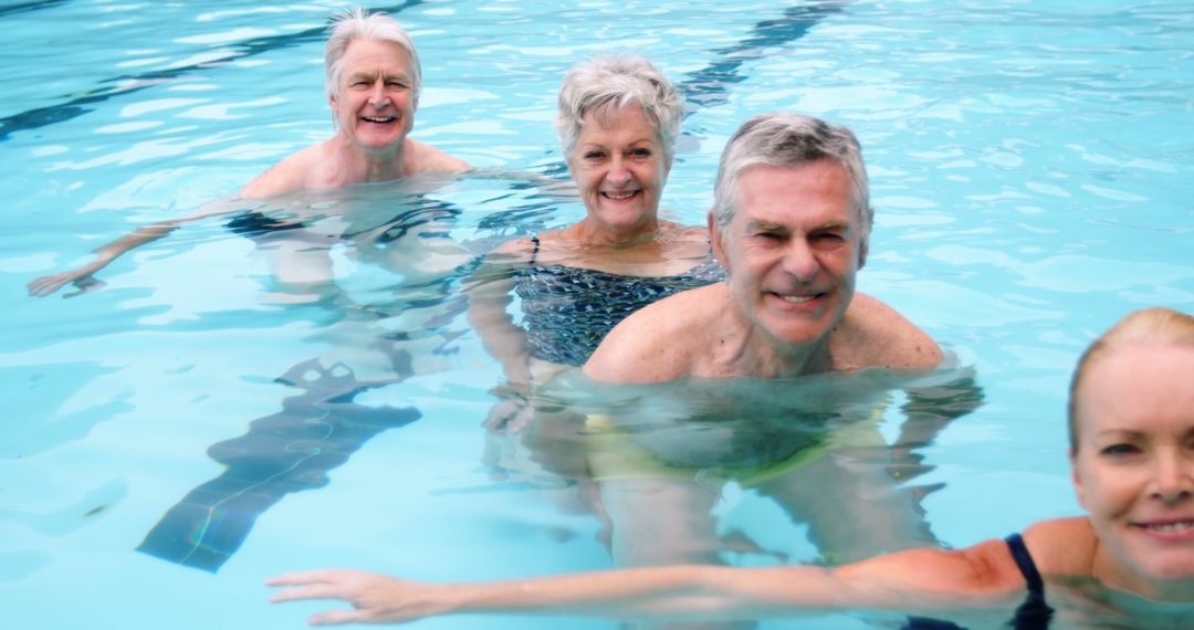 Happy Senior Adults Swimming and Enjoying Pool Time - Free Images, Stock Photos and Pictures on Pikwizard.com