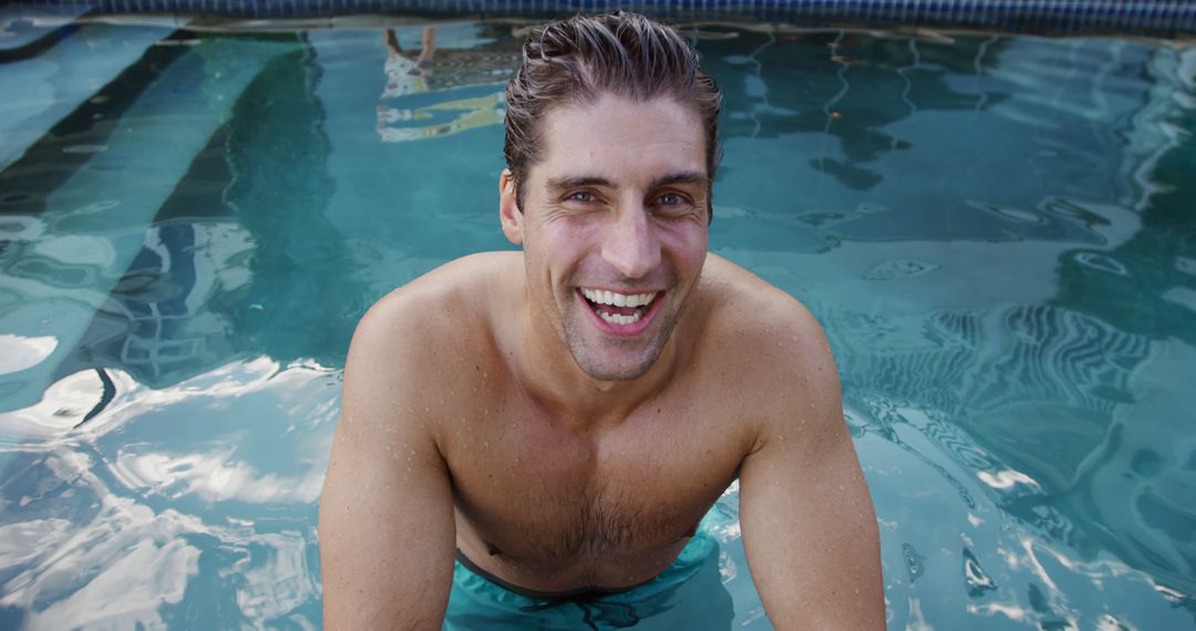 Smiling Man Relaxing in Swimming Pool - Free Images, Stock Photos and Pictures on Pikwizard.com