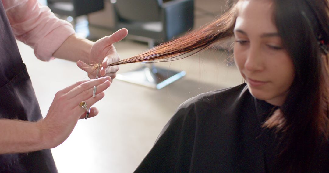 Professional Hair Stylist Trimming Young Woman's Long Hair at Salon - Free Images, Stock Photos and Pictures on Pikwizard.com