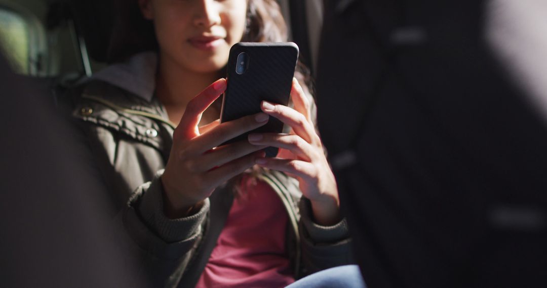 Young Woman Using Smartphone Inside Car, Checking Social Media - Free Images, Stock Photos and Pictures on Pikwizard.com