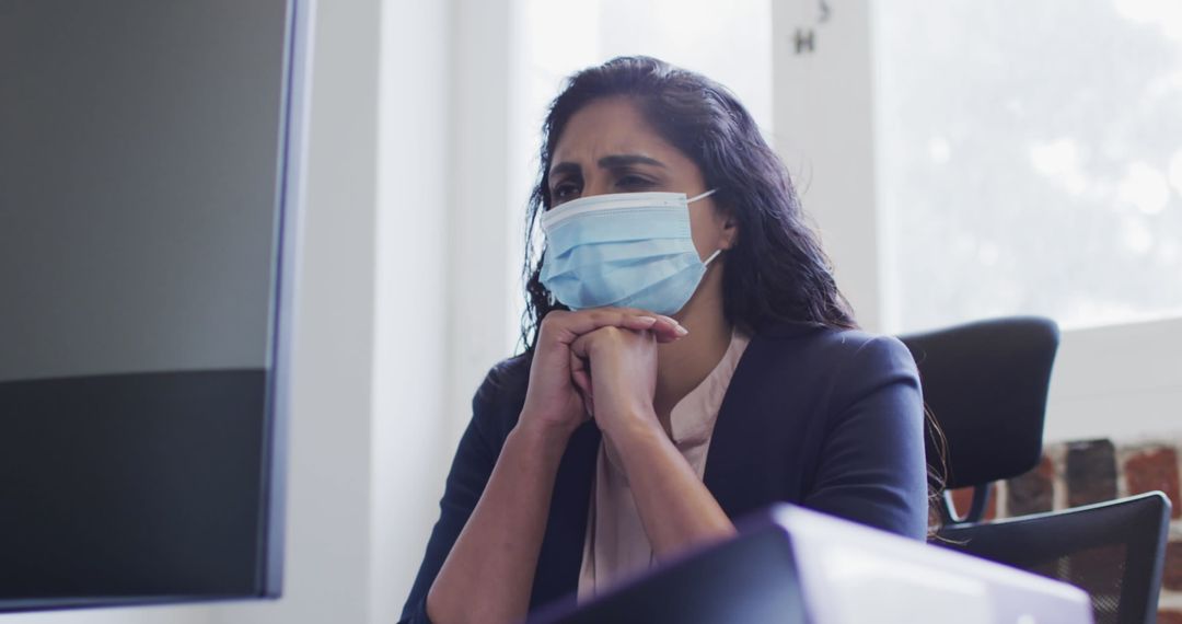 Businesswoman Analyzing Data Securely during Pandemic