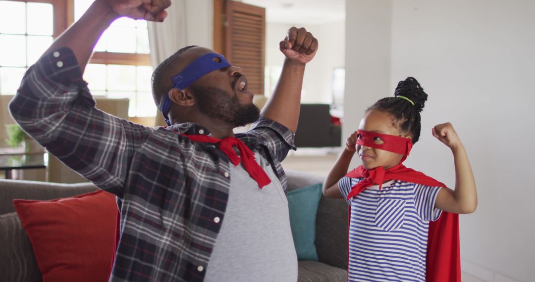 Father Daughter Bonding Wearing Superhero Costumes