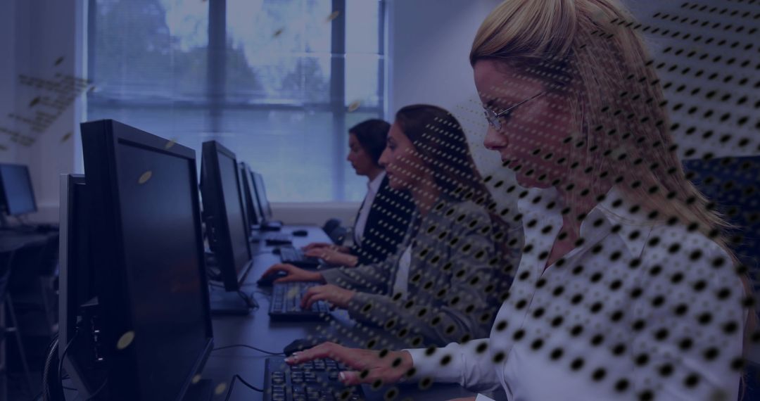Teamwork in Modern Office: Focused Workers Typing in Computer Lab