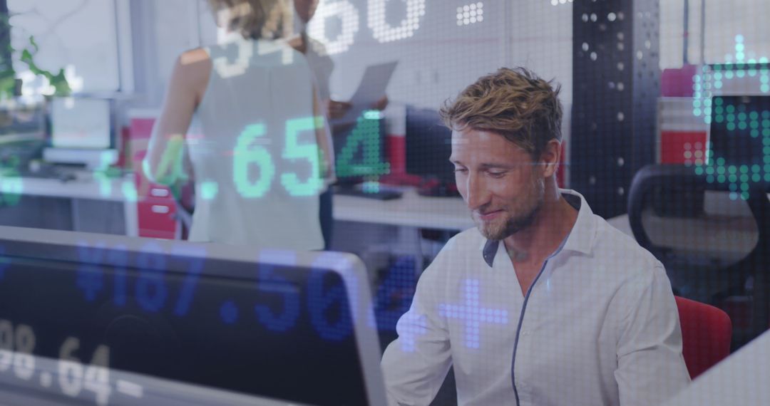 Businessman Analyzing Financial Data on Computer Screen