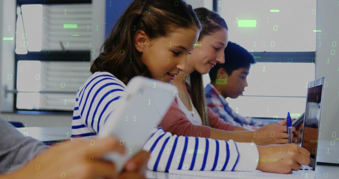 Teenagers collaborating and coding in modern computer lab with digital binary overlay