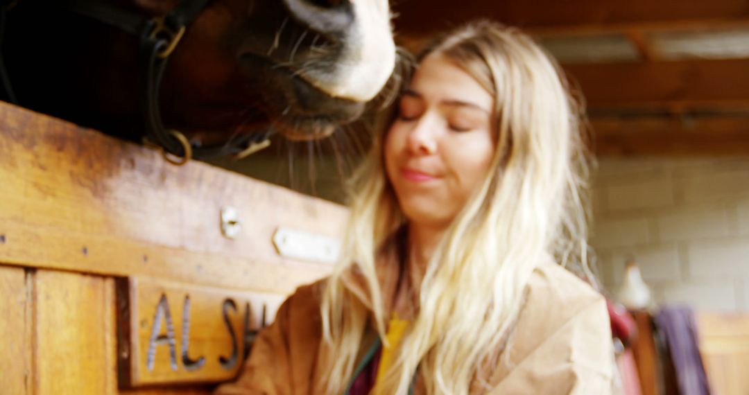 Young Woman Interacting with Horse in Stable - Free Images, Stock Photos and Pictures on Pikwizard.com
