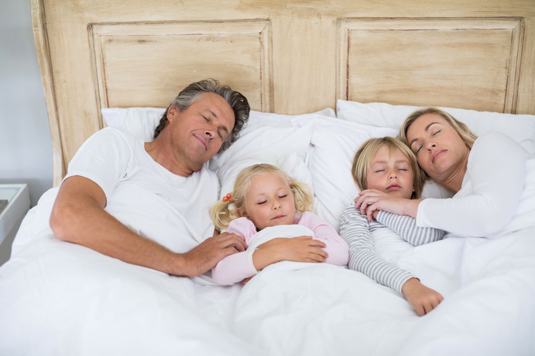 Family Sleeping Peacefully in Bed Together - Free Images, Stock Photos and Pictures on Pikwizard.com