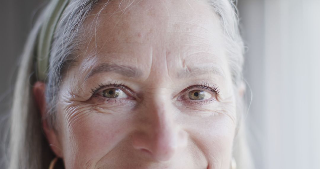 Close-up of Senior Woman with Green Eyes Smiling - Free Images, Stock Photos and Pictures on Pikwizard.com