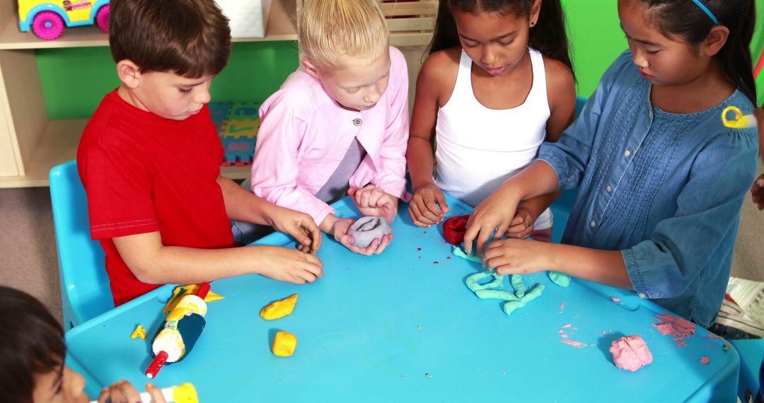 Group of Diverse Children Playing with Playdough in Classroom - Free Images, Stock Photos and Pictures on Pikwizard.com