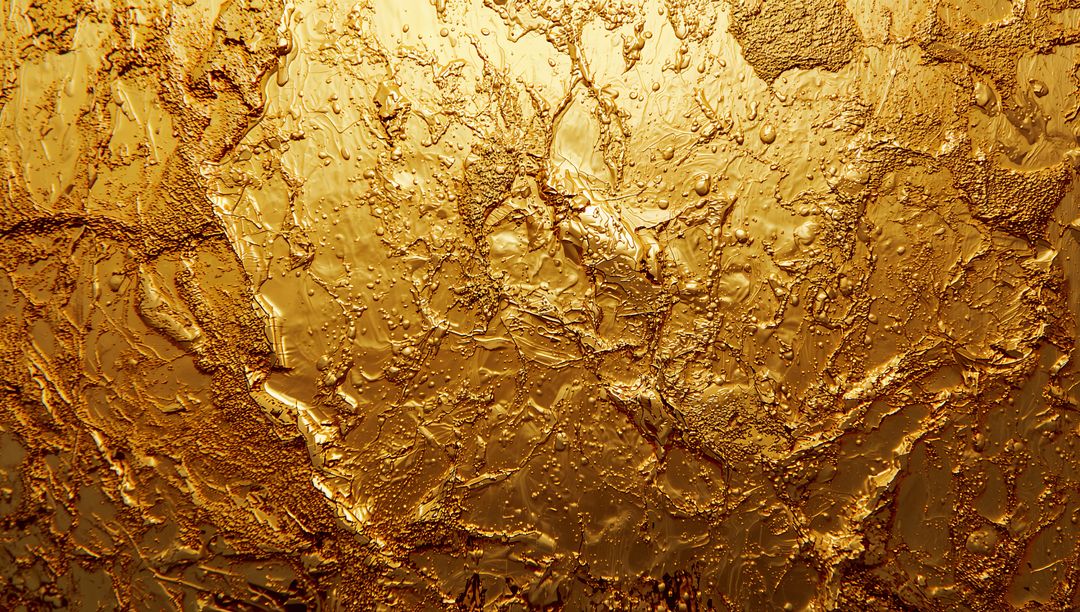 Textured Metallic Gold Surface with Ridges and Droplets
