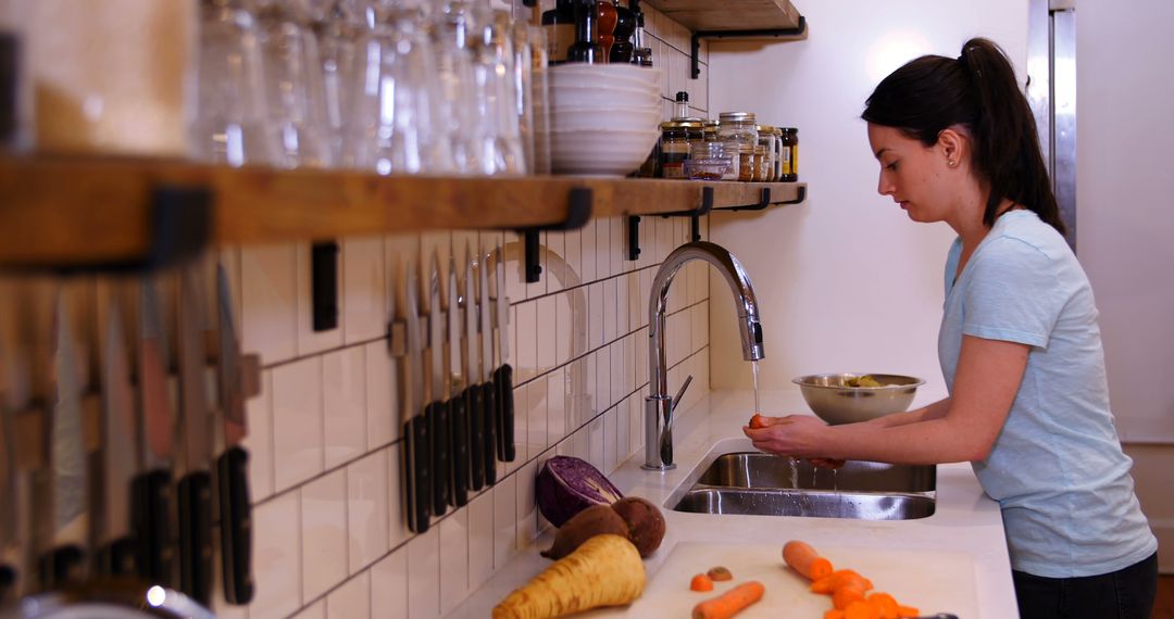 Woman Preparing Vegetables in Modern Home Kitchen - Free Images, Stock Photos and Pictures on Pikwizard.com