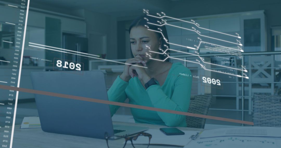 Remote data analyst working on laptop with virtual charts, smartwatch and home workspace