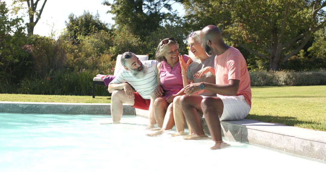 Senior Friends Laughing and Chatting by Poolside on Sunny Day