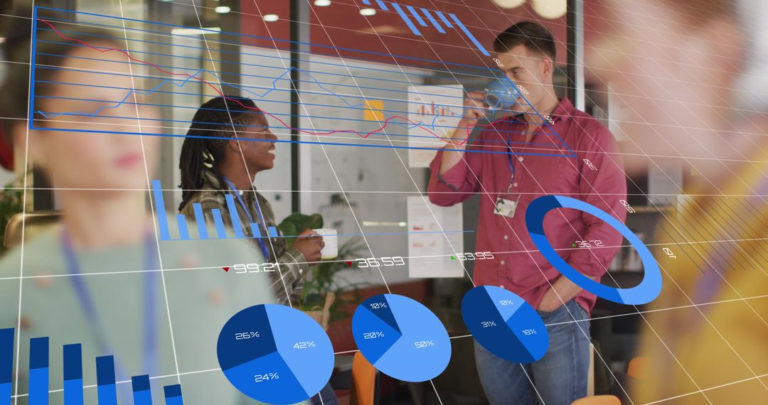 Diverse Coworkers Analyzing Digital Graphics in Modern Office