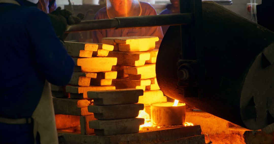 Workers Melting and Pouring Metal in an Industrial Foundry - Free Images, Stock Photos and Pictures on Pikwizard.com