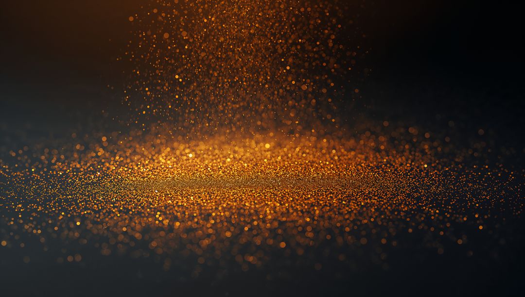 Shimmering golden glitter falling and forming glowing bokeh on dark textured surface macro