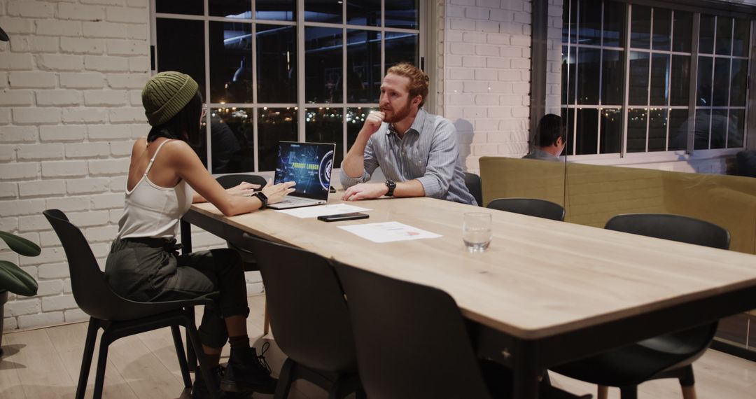 Team Collaboration During Night Shift in Modern Office Setting