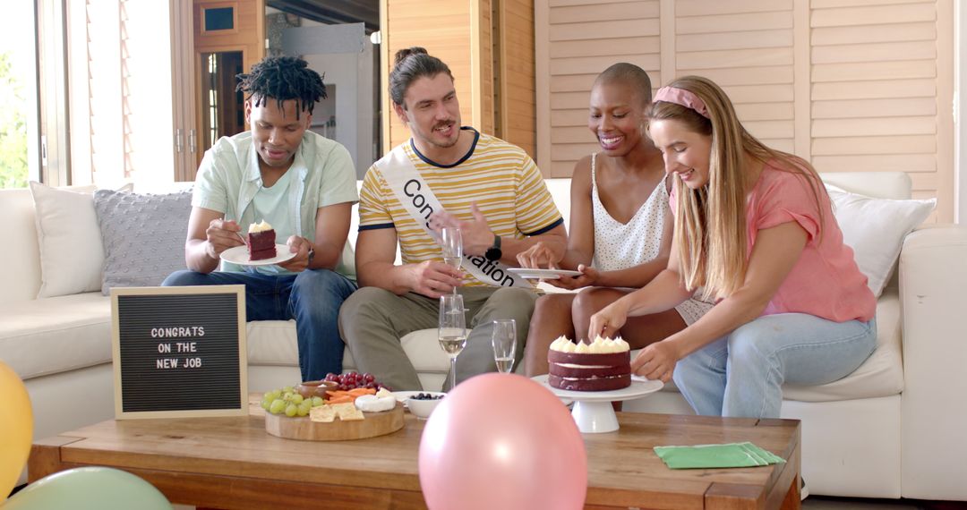 Diverse Friends Celebrating New Job with Cake in Cozy Living Room