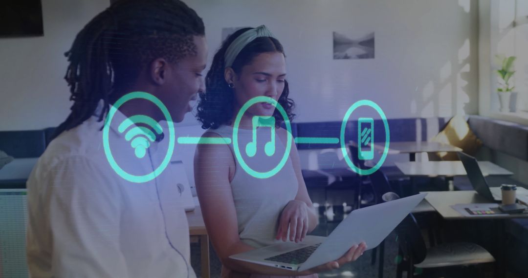 Diverse Colleagues Collaborating with Technology Integration Icons