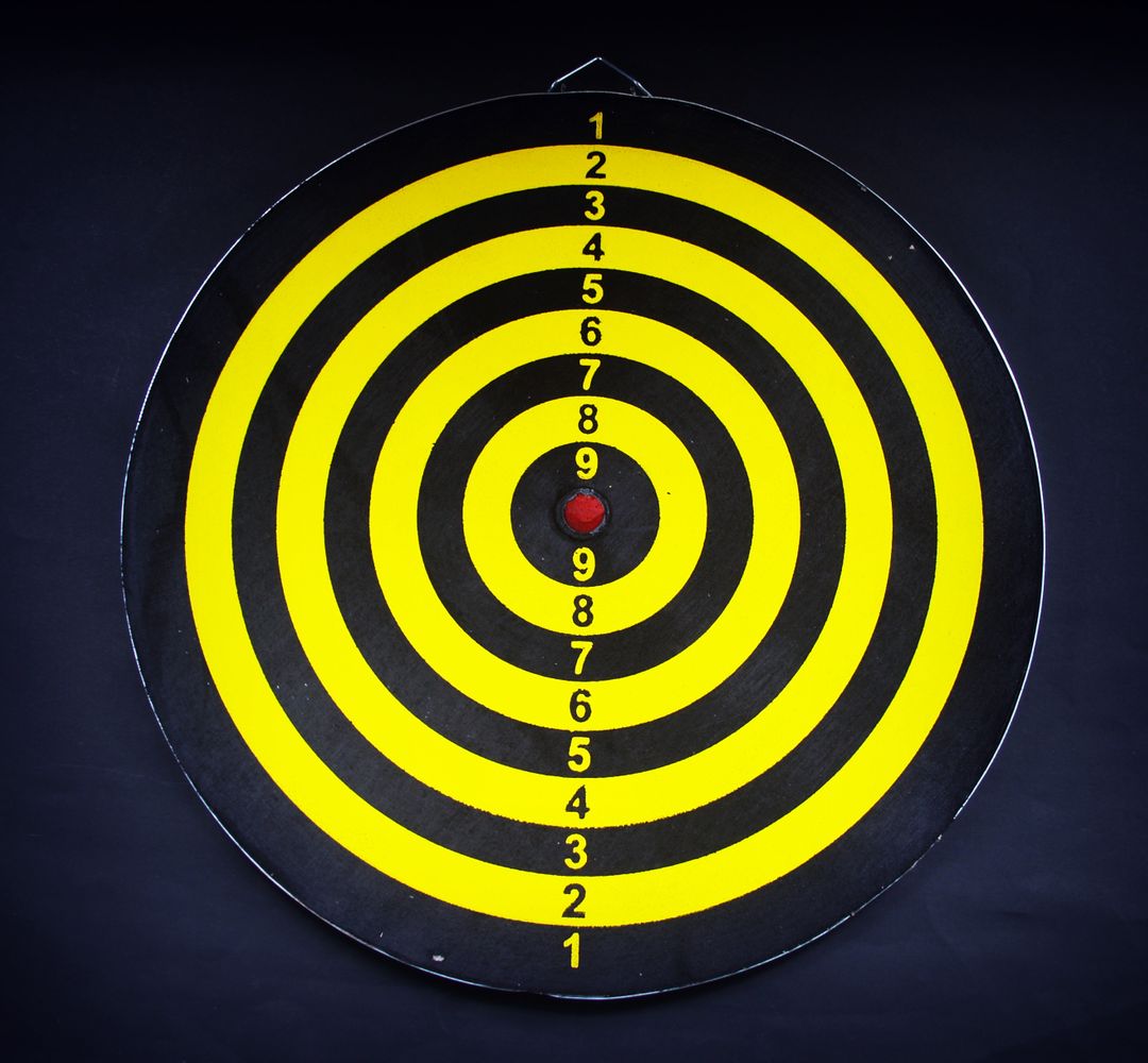 Yellow and Black Target Bullseye on Dark Background - Free Images, Stock Photos and Pictures on Pikwizard.com