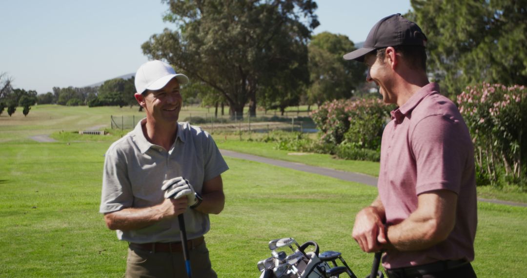 Two Men Enjoying Leisurely Golf Game On Sunny Day Outdoors - Free Images, Stock Photos and Pictures on Pikwizard.com