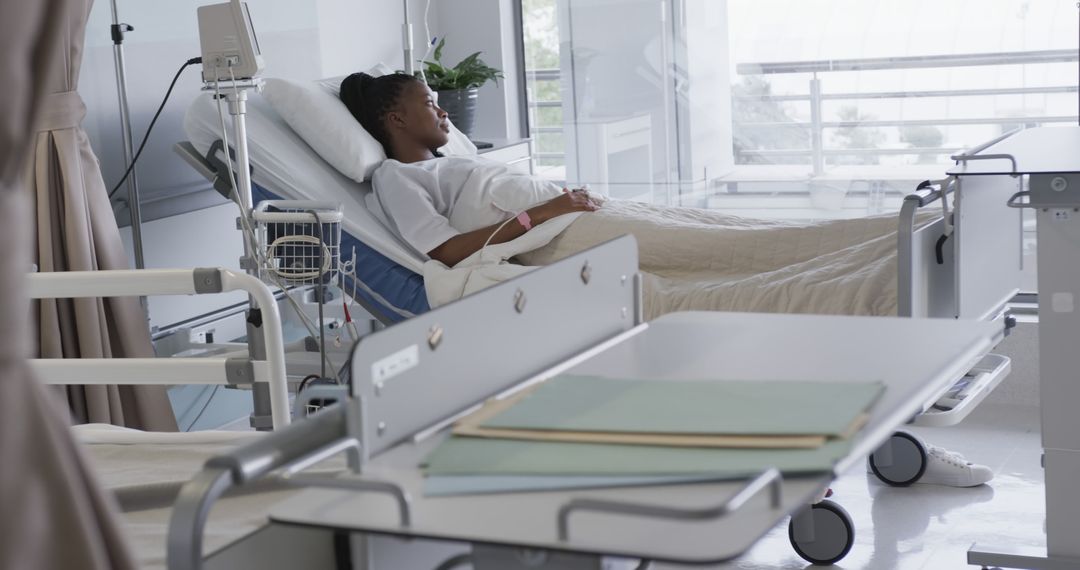 Female Patient Resting in Hospital Bed in Modern Medical Facility - Free Images, Stock Photos and Pictures on Pikwizard.com