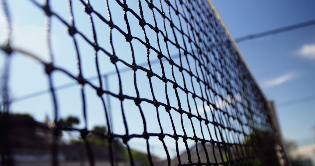 Close-up of Black Wire Mesh with Blue Sky in Background - Free Images, Stock Photos and Pictures on Pikwizard.com