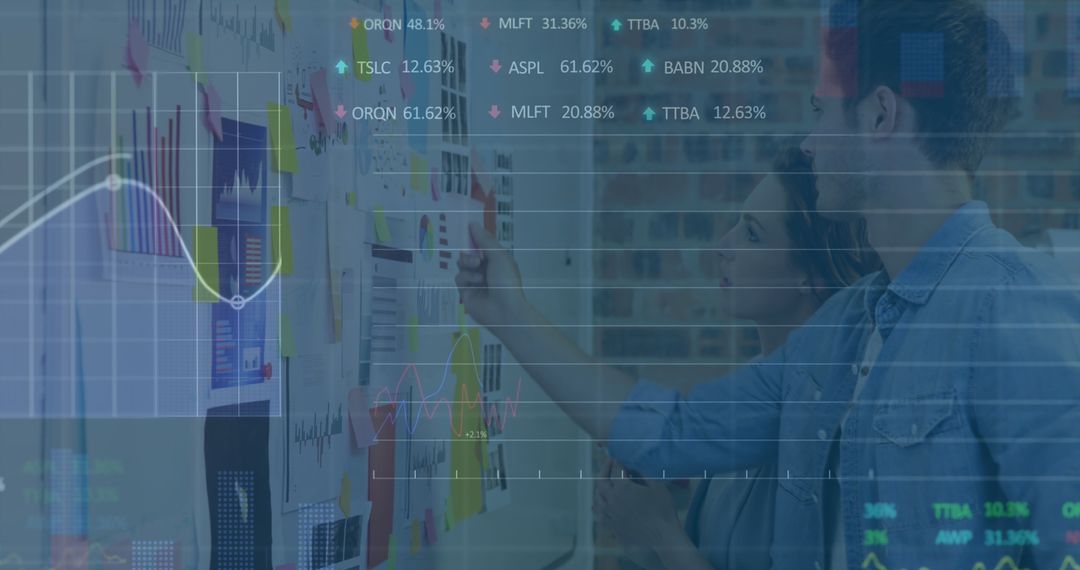 Business Analysts Exploring Data Insights in Modern Office
