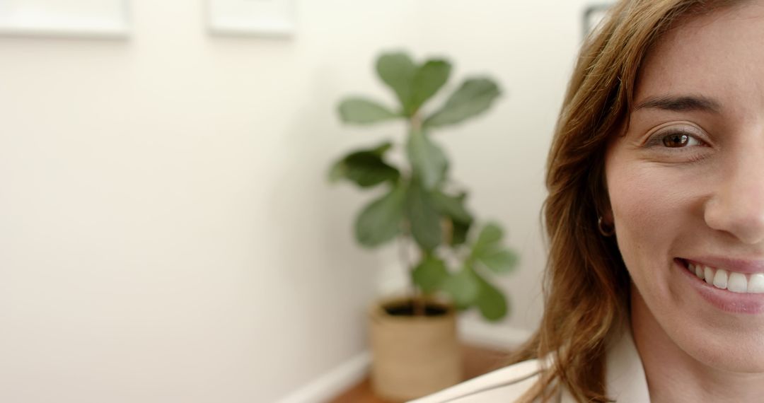 Smiling Professional Woman Wearing Blazer in Minimal Home Office with Fiddle Leaf Fig