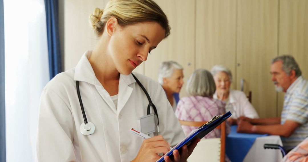 Female Doctor Taking Notes with Elderly Patients in Background - Free Images, Stock Photos and Pictures on Pikwizard.com