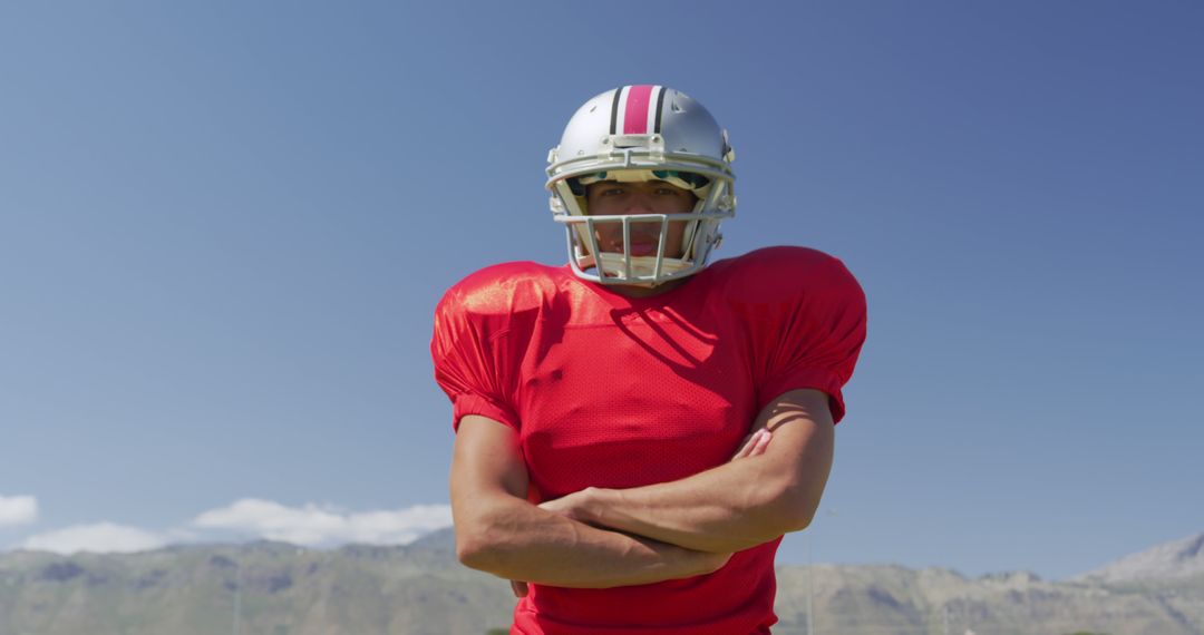 American Football Player Posing with Confidence on Sunny Day - Free Images, Stock Photos and Pictures on Pikwizard.com