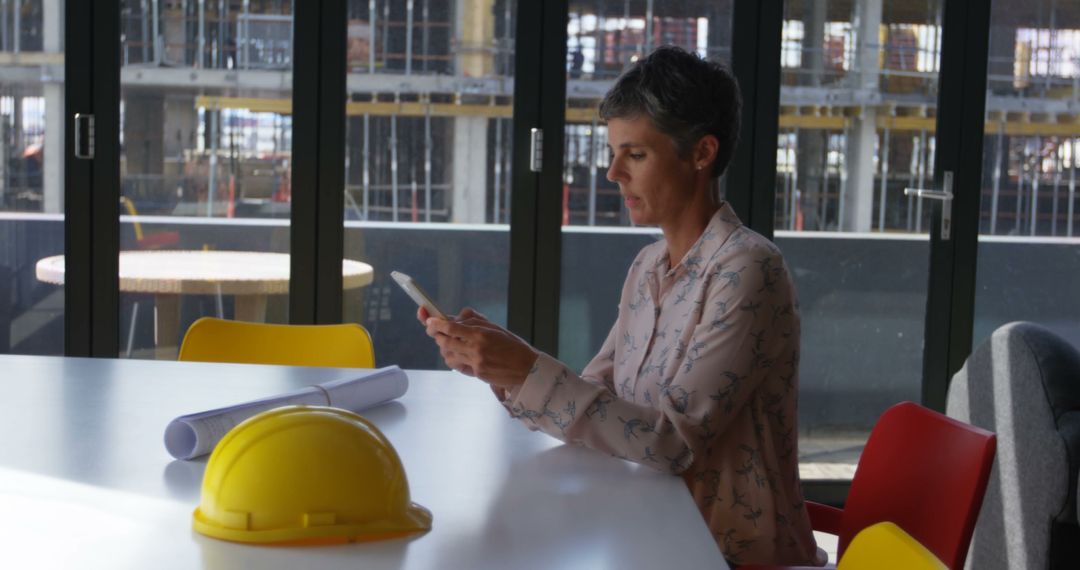 Female Architect Reviewing Construction Plans in Office - Free Images, Stock Photos and Pictures on Pikwizard.com