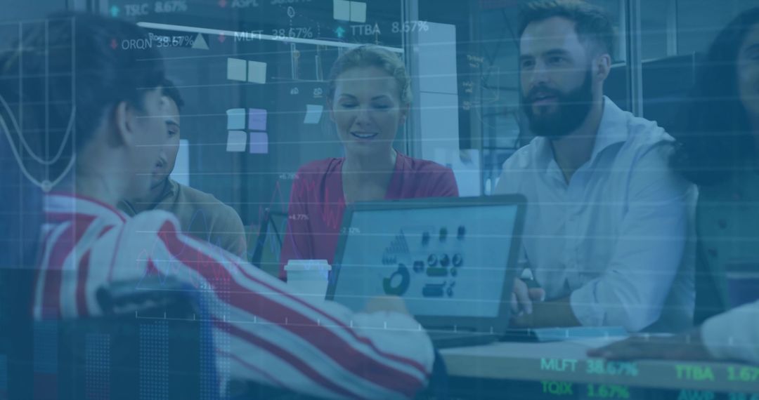 Business Team Analyzing Charts on Laptop During Meeting