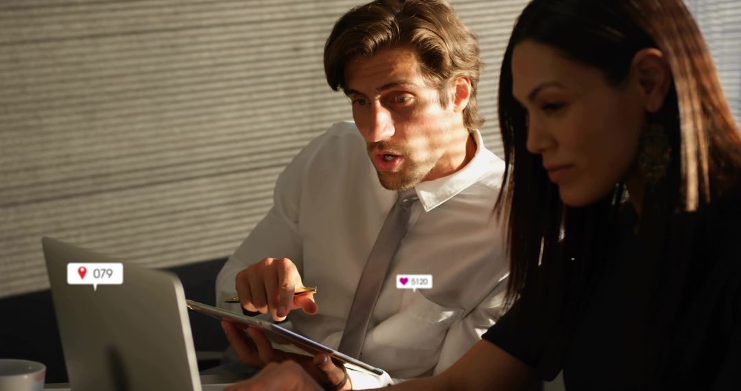 Focused Executives Analyzing Data on Tablet in Modern Office