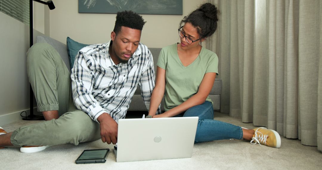 Couple Collaborating at Home on Project Together