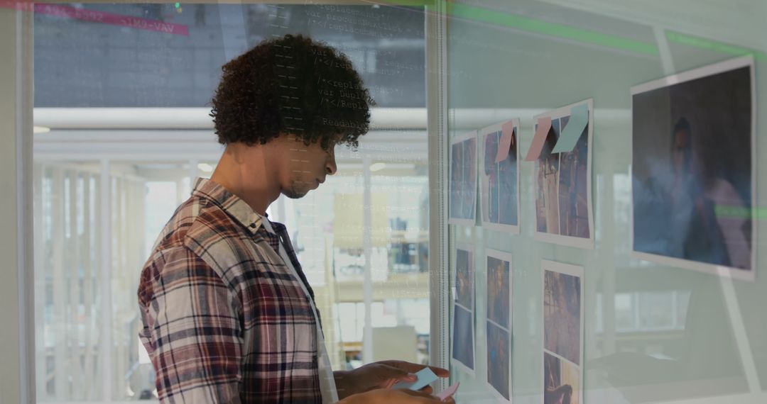 Businessman Consulting Data with Digital Overlay in Modern Office